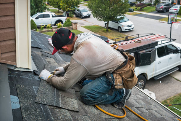 Professional Roofing technician working in Charlton City, MA